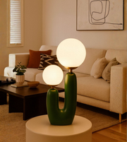 Art-inspired ambient table lamp with soft warm glow.