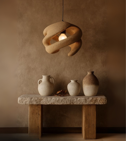 Clay spiral pendant light handcrafted from foam with warm earthy finish.