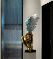 Elegant winged sculpture by Daya Worldwide featuring a sleek, artistic design suitable for modern decor and interior accents.