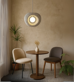 Beige modern foam pendant light hanging in a cozy interior space and cafes