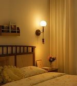 Daya Worldwide LUMA Sphere Sconce wall light mounted on a wall, featuring a modern spherical design and soft ambient lighting.
