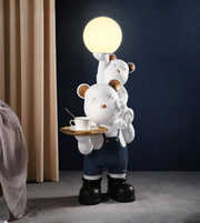 Playful bear duo sculpture by Daya Worldwide, featuring two carved bear figures in a stylish decorative statue.