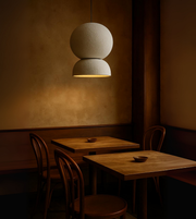 Nordic Glow all-white sculptural pendant light above wooden furniture