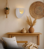 Moon Arc sculptural white wall light glowing softly, Perfect for cafes, living room, room and boho theme 