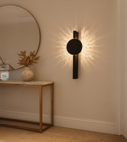 Lumina black wall lights mounted in a modern luxury living room