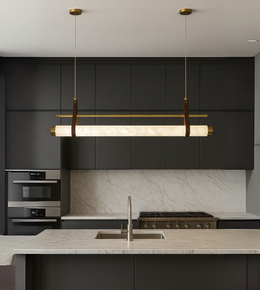 Axis Marble Linear Light in brushed gold and marble finish illuminating a modern kitchen