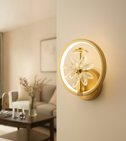 Modern circular LED wall light with amber crystal flower accents mounted on a wooden interior wall