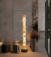 Designer marble floor lamp placed in a contemporary interior setting