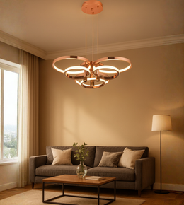 Nova Rings chandelier with gold finish illuminating beige-toned modern living space.