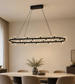 Modern black oval LED ring chandelier with multiple cylindrical lights suspended over a luxury dining table.