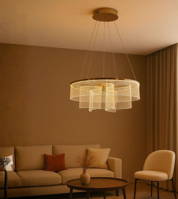 Sereno Curve chandelier with layered golden glass ribbons lighting up warm beige lounge.