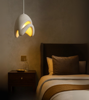 Cloud Drift Foam Pendant in white sculptural form illuminating a modern dining and bedroom interior.