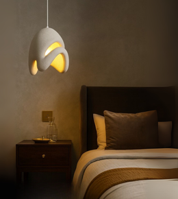 Cloud Drift Foam Pendant in white sculptural form illuminating a modern dining and bedroom interior.
