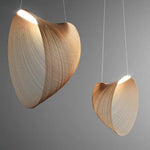 Two wooden pendant lights with a modern design on a gray background