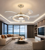 Modern crystal fandelier with brushed gold finish installed in a luxury living room ceiling