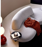 Modern Luna Curve modular sofa by Daya Worldwide, featuring sleek curves and plush cushions in a contemporary living room setting.