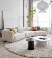 Daya Worldwide Curve Sofa with plush fabric upholstery and modern design, showcasing its sleek, curved shape and comfortable seating.