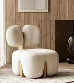 Daya Worldwide Milo armchair with plush cushions and wooden legs, modern design suitable for living room seating.