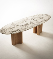 Elegant sculpted marble and wood dining table by Daya Worldwide with a modern, artistic design for stylish dining spaces.