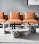 Daya Worldwide Arcus marble coffee table with sleek design, featuring a round marble top and modern metal legs.