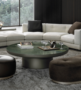 Round green coffee table by Daya Worldwide, featuring a smooth surface and modern design, perfect for living room decor.