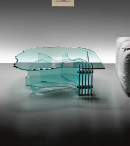 Modern Aqua Rift coffee table by Daya Worldwide featuring a sleek, sculptural design and a glossy blue finish in a contemporary living room setting.
