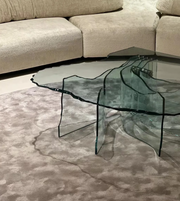 Aqua Rift coffee table by Daya Worldwide featuring a modern design with a sleek blue glass top and wooden base.