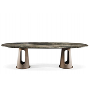 Obsidian oval dining table with sleek black surface and modern design, crafted by Daya Worldwide for elegant dining spaces.
