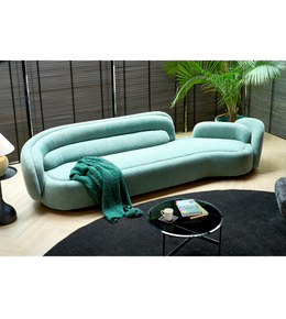 Daya Worldwide Aura Curve Sofa with sleek modern design, plush cushions, and smooth curves in a contemporary living room setting.