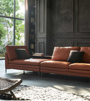 Daya Worldwide Linea Luxe leather sofa with sleek modern design, plush cushions, and smooth leather upholstery in a contemporary living room setting.