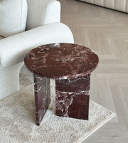 Burgundy marble side table with sleek design, featuring a round top and sturdy base, from Daya Worldwide.