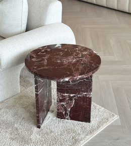 Burgundy marble side table with sleek design, featuring a round top and sturdy base, from Daya Worldwide.