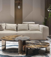 Set of two marble coffee tables featuring sleek white marble tops and modern black metal legs, by Daya Worldwide.
