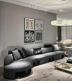 Curved Nova modular sofa by Daya Worldwide featuring plush cushions and sleek design in a modern living room setting.