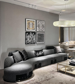 Curved Nova modular sofa by Daya Worldwide featuring plush cushions and sleek design in a modern living room setting.