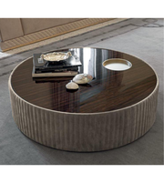 Round coffee table by Daya Worldwide with a sleek wooden top and modern metal legs, ideal for living room decor.