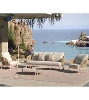 Outdoor dining set by Daya Worldwide featuring a table and chairs, perfect for outdoor patio or garden use.