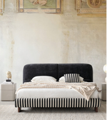 Stripe upholstered bed by Daya Worldwide featuring a modern design with a padded headboard and soft fabric upholstery.