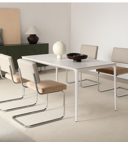 A modern Aero dining table by Daya Worldwide, featuring a sleek design with a smooth wooden surface and sturdy legs.