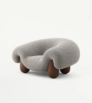 Plush sculptural lounge chair by Daya Worldwide featuring a modern, cushioned design ideal for stylish living spaces.