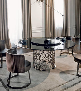 Luxury marble dining table with a geometric metal base, featuring a sleek, polished surface for modern dining rooms.