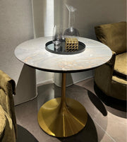 Marble pedestal dining table with sleek design, showcasing a round marble top and sturdy base, ideal for modern dining rooms.