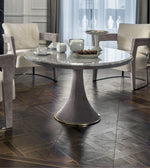 Round marble pedestal dining table with sleek design, featuring a sturdy base and smooth marble surface for modern dining spaces.