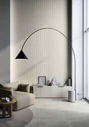 Curved floor lamp with glass orb lights in modern living room