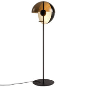 Full view of contemporary black floor lamp with glass shade