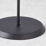 Matte black metal base of contemporary floor lamp