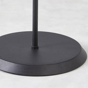 Matte black metal base of contemporary floor lamp