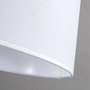 Detail view of white fabric lampshade with smooth finish