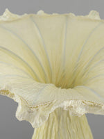 Detail view of flared top design of artistic floor lamp