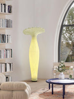 Designer floor lamp with flower-inspired silhouette in luxury living room